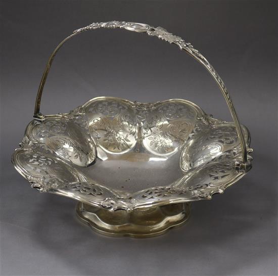 A Victorian engraved silver cake basket, Edward Ker Reid, London, 1857, 20 oz.